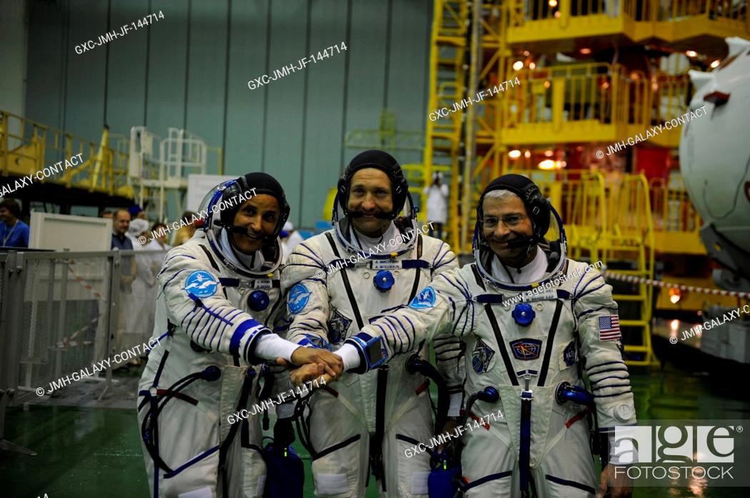 Stock Photo: In the Integration Facility at the Baikonur Cosmodrome in Kazakhstan, the Expedition 53-54 crewmembers pose for pictures Aug.