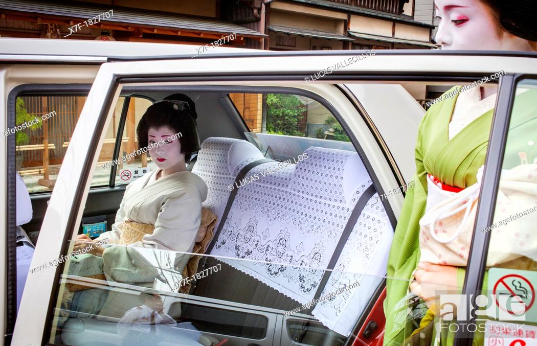 Stock Photo: Fukuyu, geisha and Fukukimi, 'maiko' geisha apprenticein taxi going to work Geisha's distric of Miyagawacho Kyoto  Kansai, Japan.