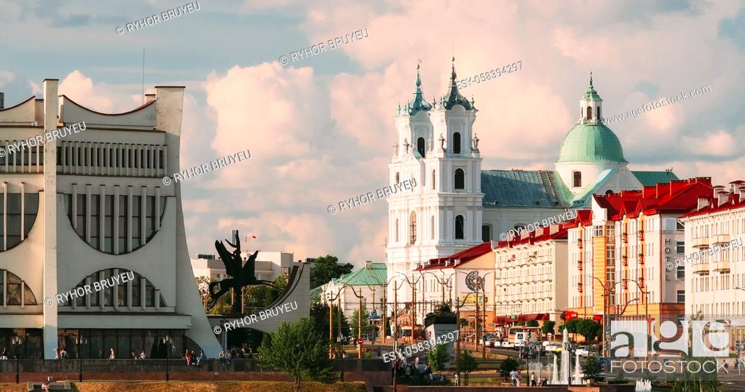 Stock Photo: Grodno, Belarus. Grodno Regional Drama Theatre, St. Francis Xavier Cathedral And Traffic In Mostowaja And Kirova Streets In Sunny Summer Day.
