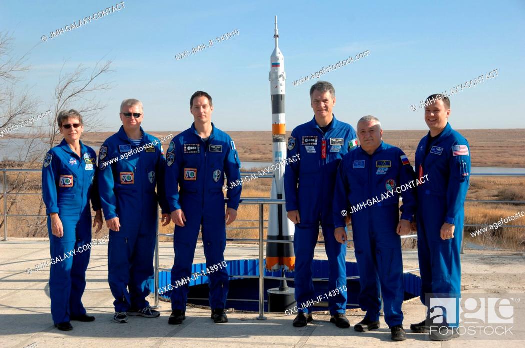 Stock Photo: At the Cosmonaut Hotel crew quarters in Baikonur, Kazakhstan, the Expedition 50-51 prime and backup crewmembers pose for pictures Nov.