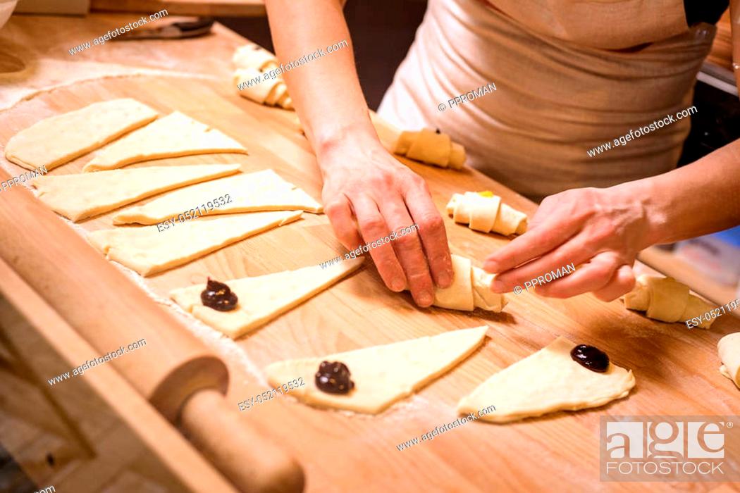 Stock Photo: baker concept. Make wheat croissant on wooden table, fresh bakery.