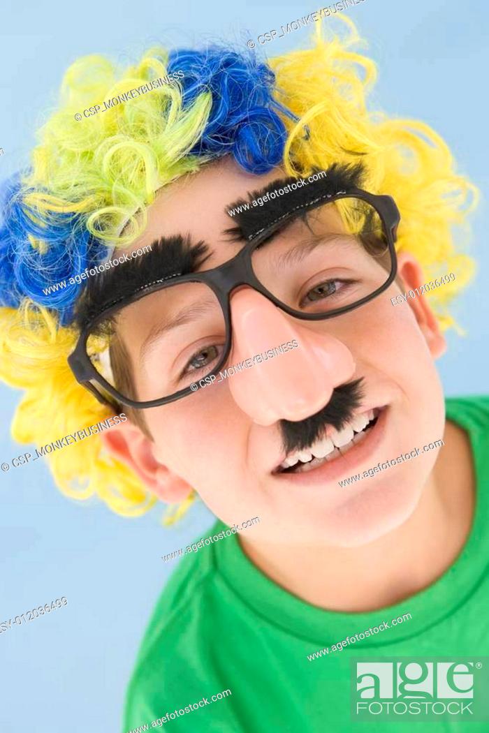 Young boy wearing clown wig and fake nose, Stock Photo, Picture And Low  Budget Royalty Free Image. Pic. ESY-012036499 | agefotostock