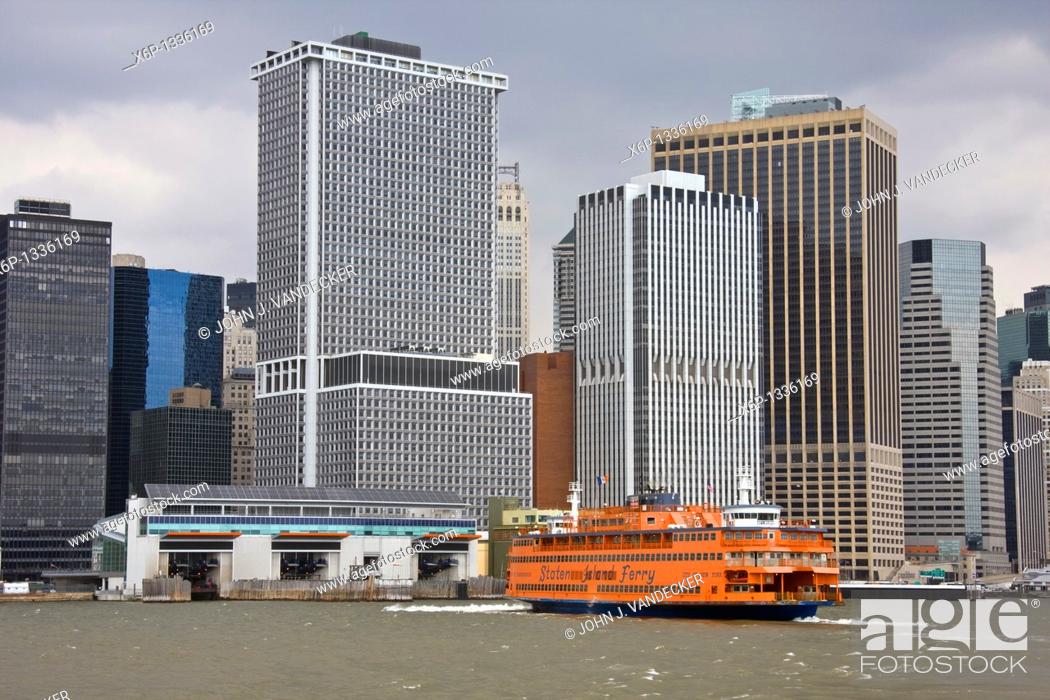 Stock Photo: Staten Island Ferry approaching dock in lower Manhattan, New York City.