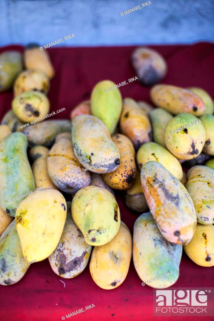 Stock Photo: Thai mangos on a market stall.