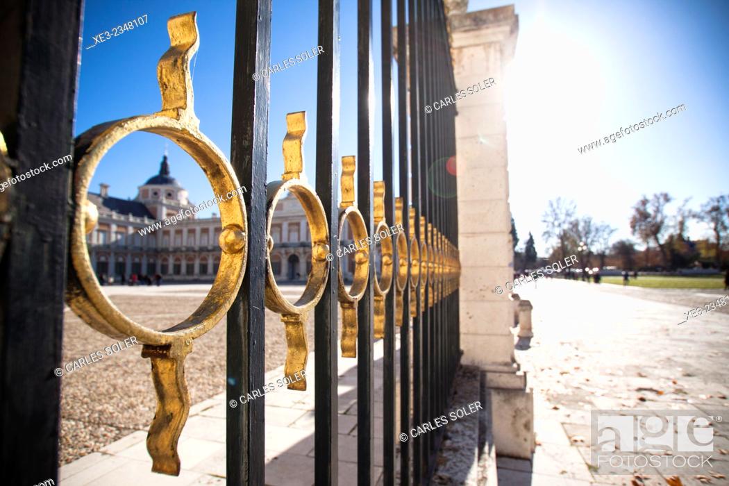 Stock Photo: Spain, Madrid Province, Aranjuez, View of Royal Palace through architectural details of gate.