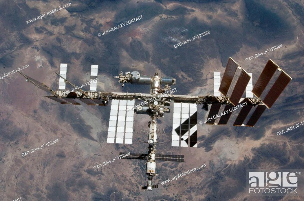 Stock Photo: The International Space Station is featured in this image photographed by an STS-132 crew member on space shuttle Atlantis after the station and shuttle began.