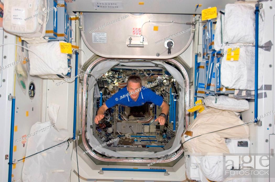 Stock Photo: NASA astronaut Piers Sellers, STS-132 mission specialist, floats through a hatch into the Unity node of the International Space Station while space shuttle.