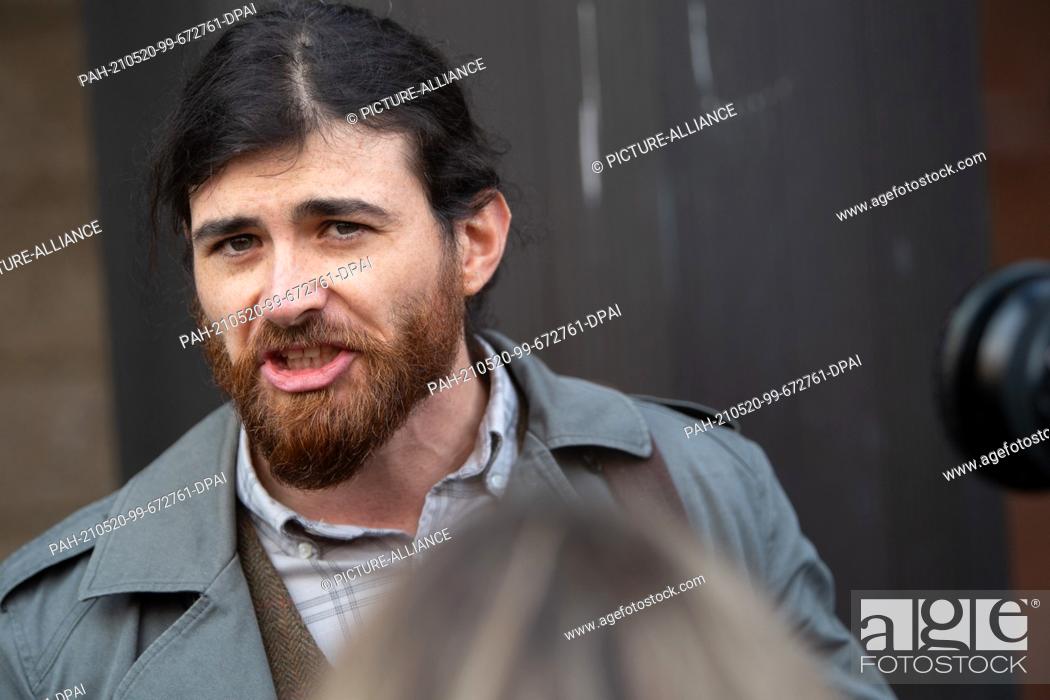 Stock Photo: 20 May 2021, Hessen, Frankfurt/Main: The defendant Franco A. talks to journalists before the start of a trial on charges of preparing a serious act of violence.