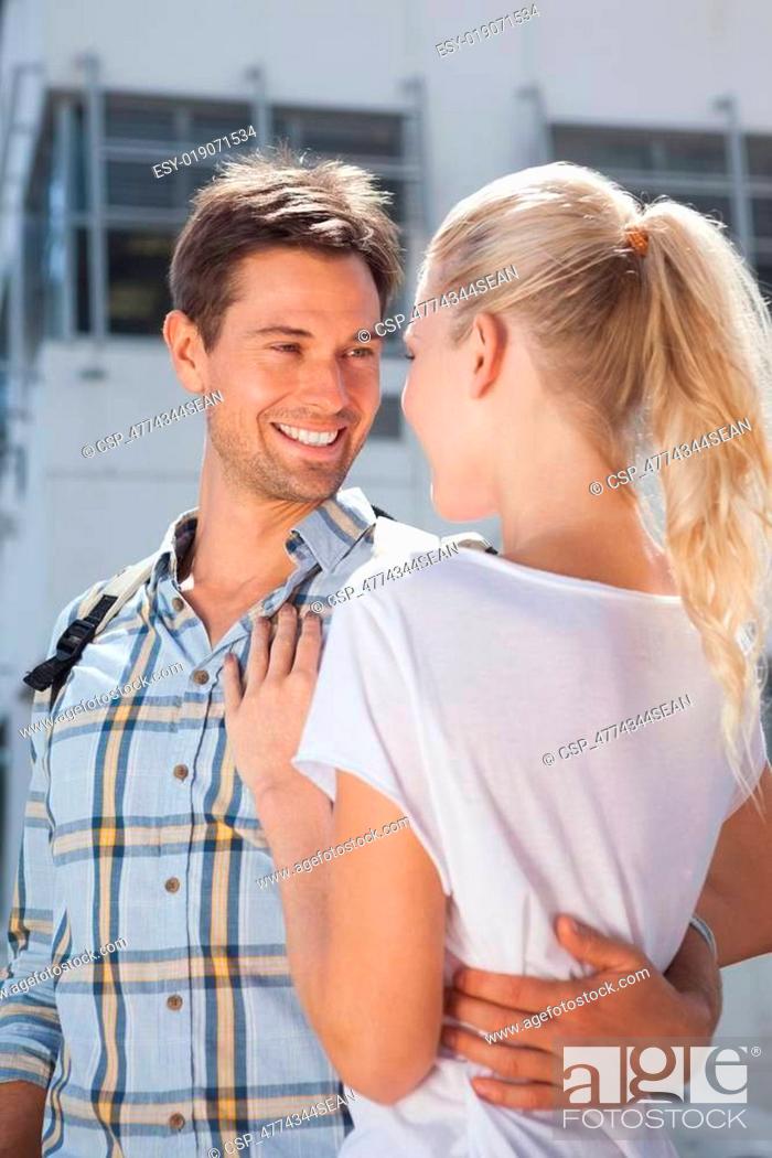 Stock Photo: Stylish young couple smiling at each other.