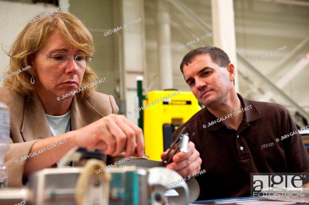 Stock Photo: NASA astronauts Sandy Magnus and Rex Walheim, both STS-135 mission specialists, participate in an EVA Thermal Protection System (TPS) overview training session.