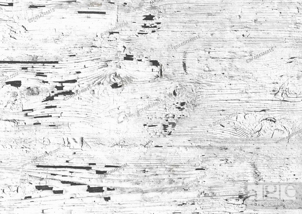 Stock Photo: Cracked white paint on wood. Wooden wall with white paint is severely weathered and peeling.