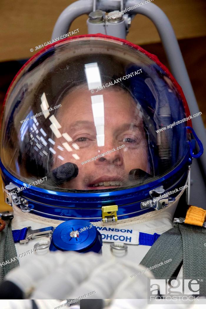 Stock Photo: In the Integration Facility at the Baikonur Cosmodrome in Kazakhstan, Expedition 3940 Flight Engineer Steve Swanson of NASA undergoes a pressure check for his.