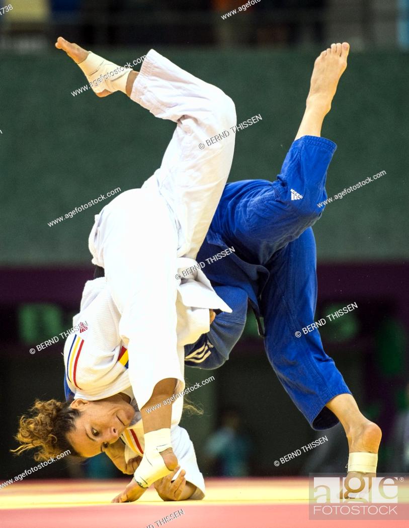 Stock Photo: Germanys Mareen Kraeh (blue) competes with Andreea Chitu of Rumania in the Women's -52kg Judo Women's Semifinal of Table B at the Baku 2015 European Games in.