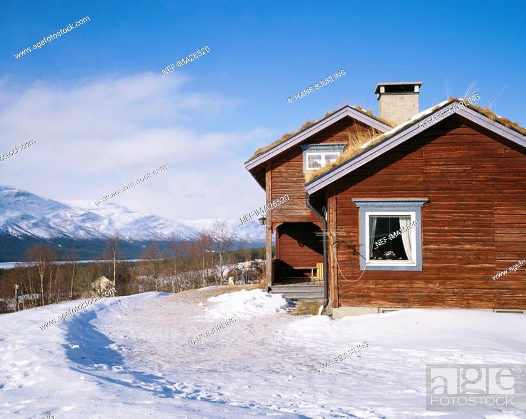 Stock Photo: Wooden country house in winter landscape.