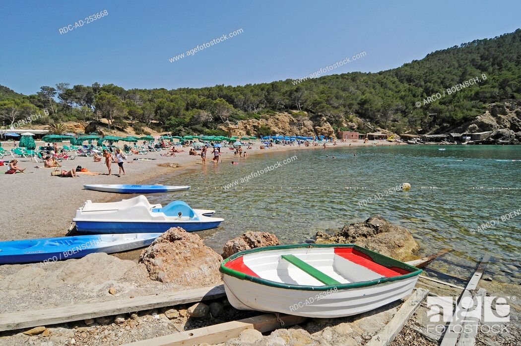 Stock Photo: Boats and vacationists at beach bay Cala Benirras Ibiza Pityuses Balearic Islands Spain San Juan Bautista slipway.