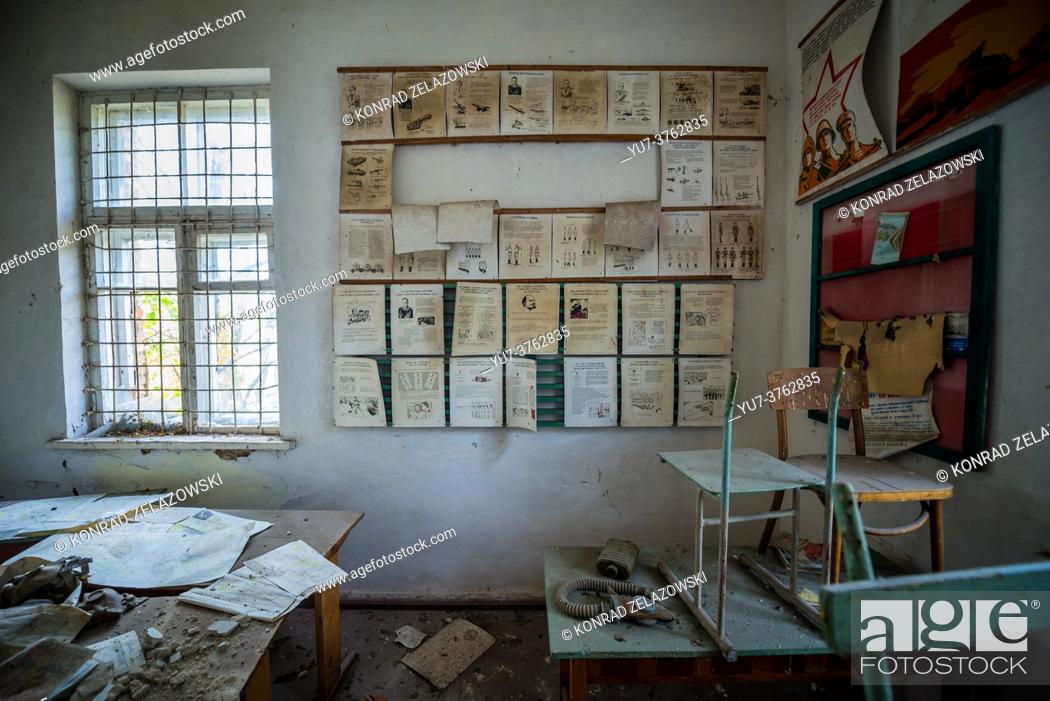Stock Photo: Classroom in old secondary school in Mashevo abandoned village of Chernobyl Nuclear Power Plant Zone of Alienation in Ukraine.