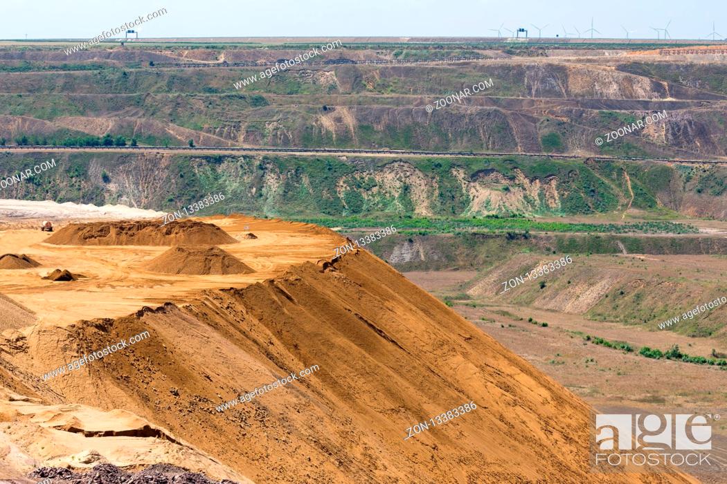 Stock Photo: Brown coal open pit landscape with recycling raw materials in Garzweiler mine Germany.