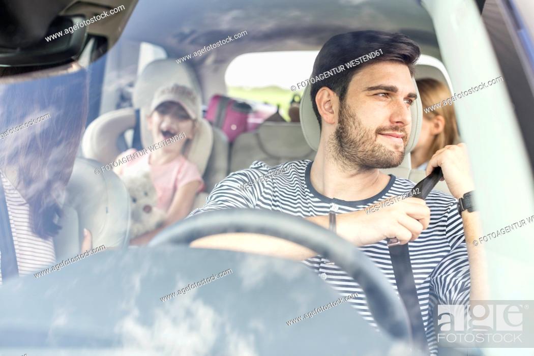 Stock Photo: Happy family doing a road trip.