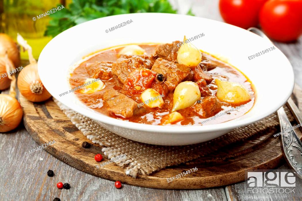 Stock Photo: Stifado. Stewed beef with onions and tomatoes.