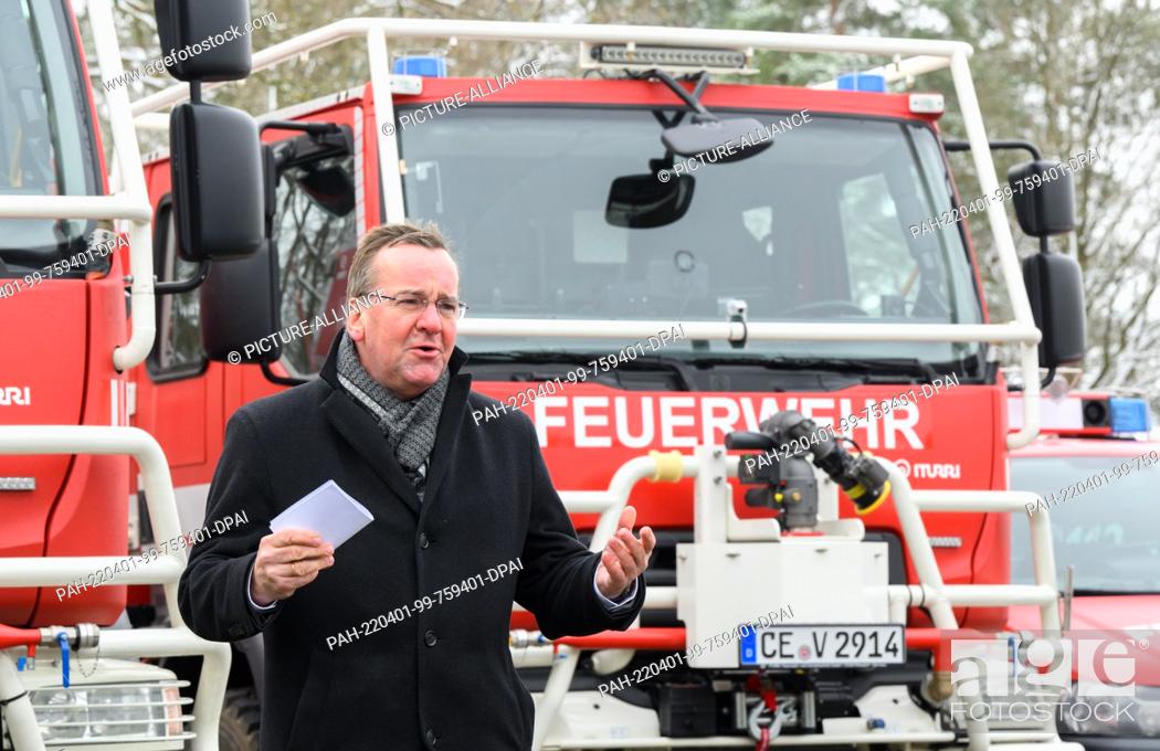 Stock Photo: 01 April 2022, Lower Saxony, Celle: Boris Pistorius (SPD), Minister of the Interior of Lower Saxony, stands in front of forest fire fighting vehicles ""CCFM.