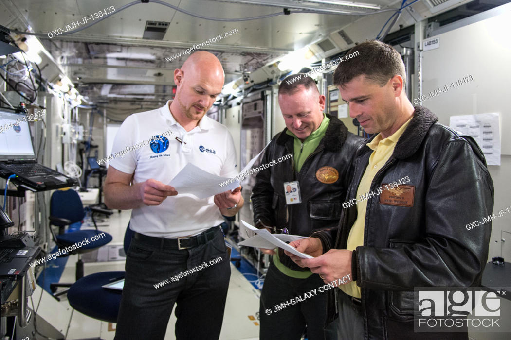 Stock Photo: NASA astronaut Barry Wilmore (center), Expedition 41 flight engineer and Expedition 42 commander; and European Space Agency astronaut Alexander Gerst (left) and.