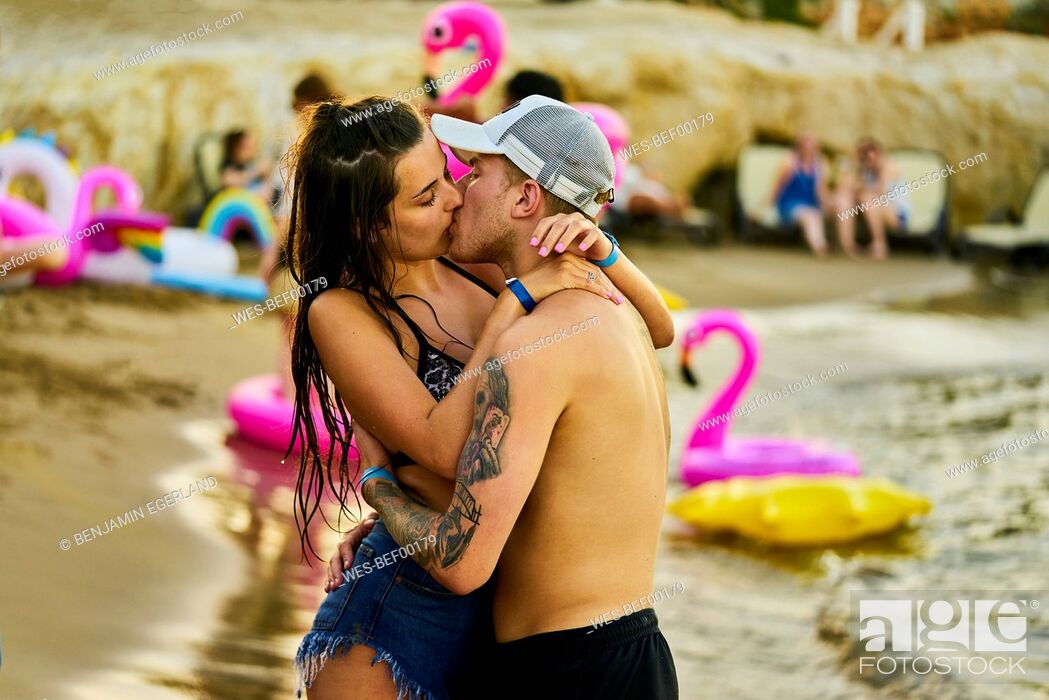Photo de stock: Greece, Crete, passionate lovers kissing at beach party.