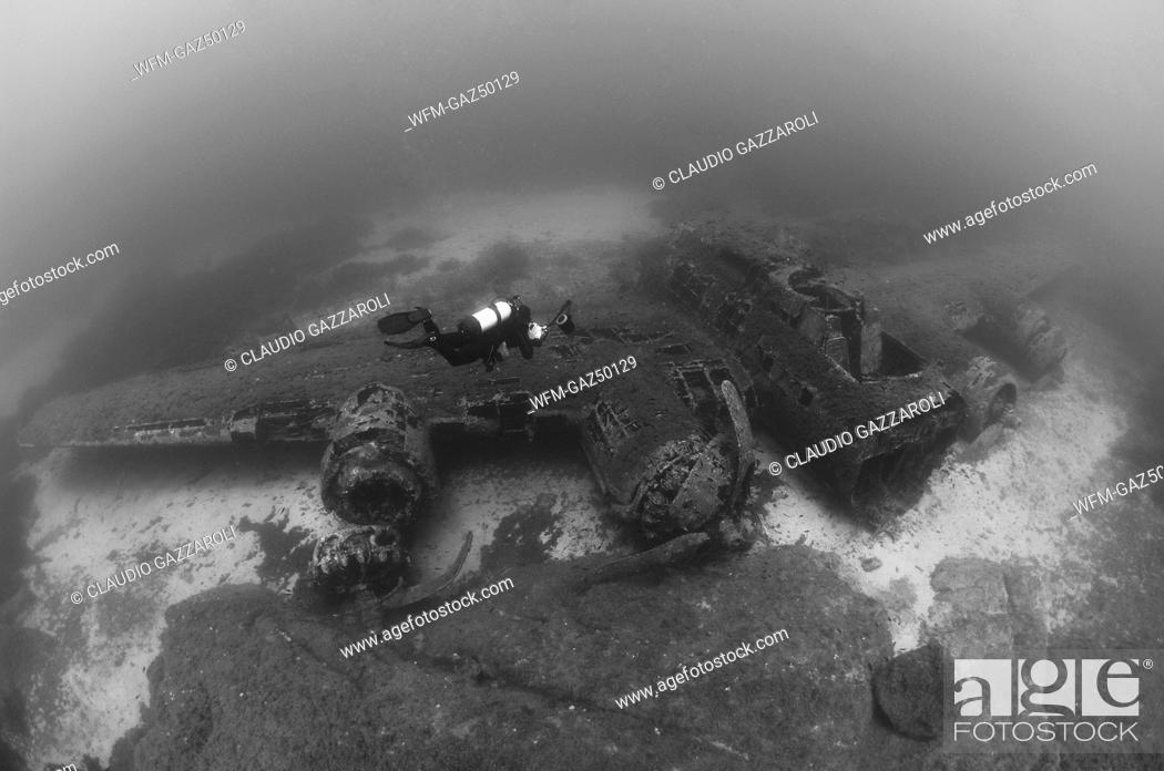 Stock Photo: Scuba Diver at B 17 Bomber Airplane Wreck, Corsica, France.