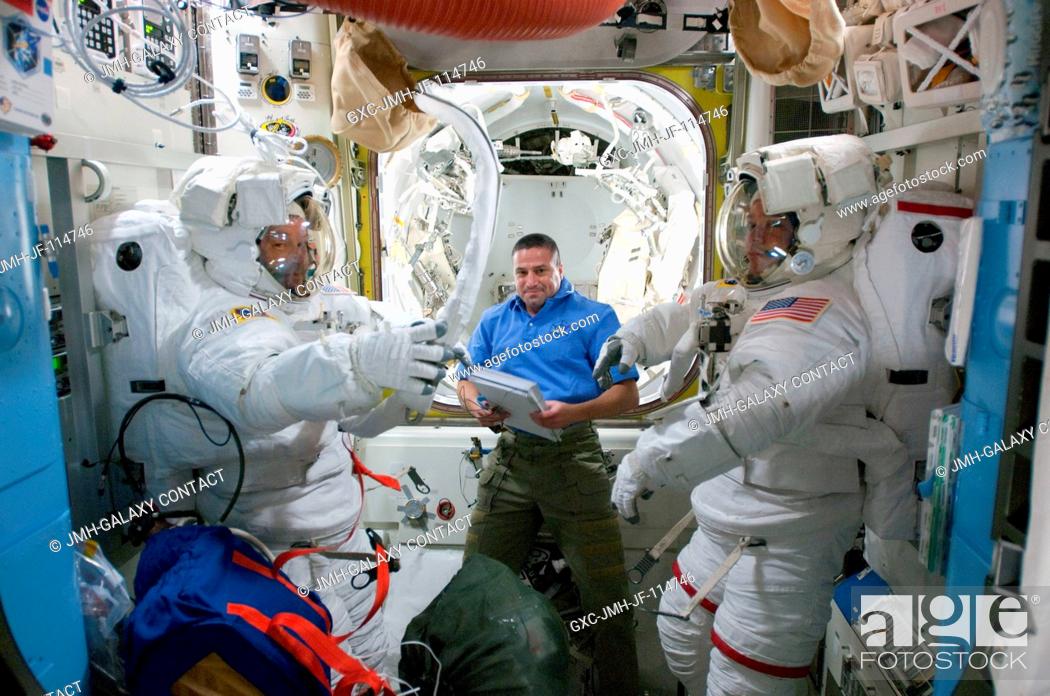 Stock Photo: NASA astronauts Nicholas Patrick (left) and Robert Behnken, both STS-130 mission specialists, attired in their Extravehicular Mobility Unit (EMU) spacesuits;.