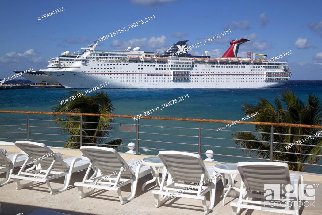 Stock Photo: Mexico, Quintana Roo, Cozumel Island, Cruise Ship in Port & Sun Loungers.