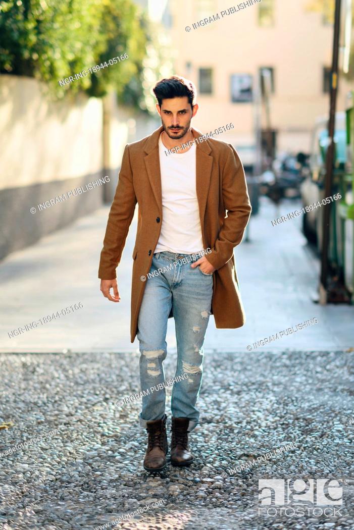 Young man wearing winter clothes in the street. Young bearded guy with  modern hairstyle with coat, Stock Photo, Picture And Royalty Free Image.  Pic. NGR-ING-18944-05166 | agefotostock