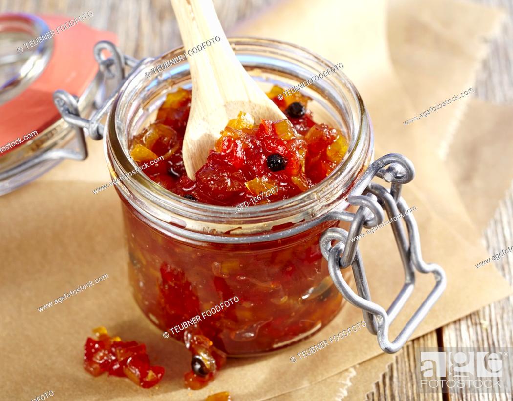 Stock Photo: Spicy pepper relish in a flip-top jar.