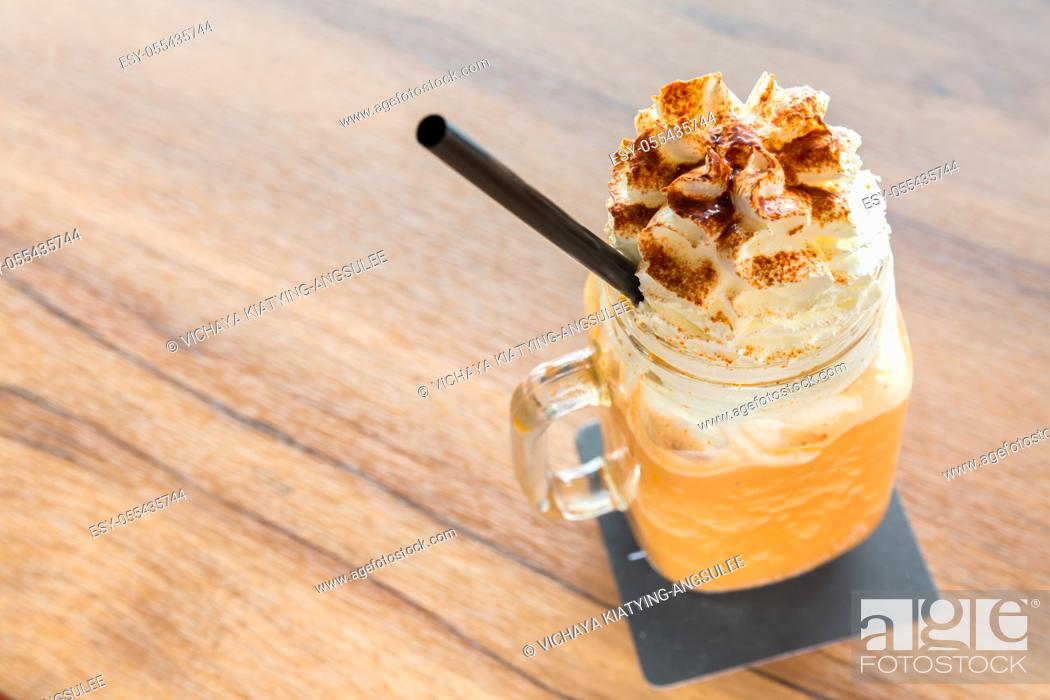 Stock Photo: glass of Ice milk tea with Whipped Cream.