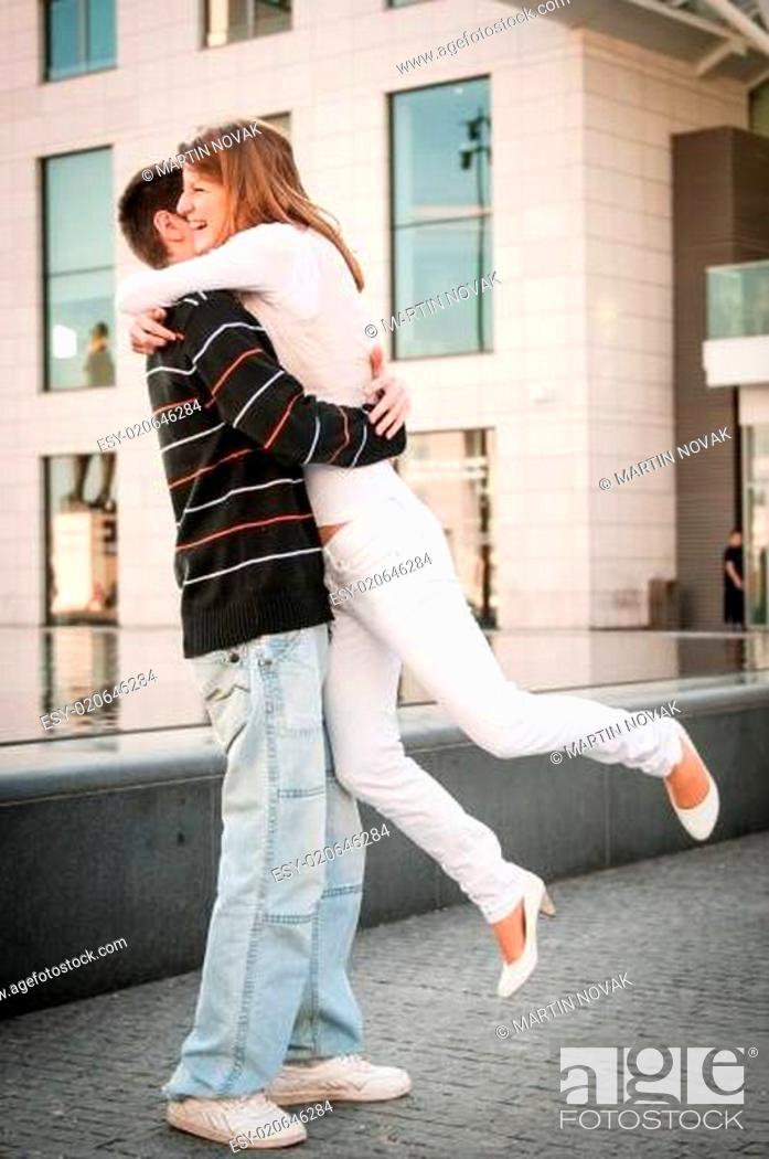 Stock Photo: Young man welcomes his girlfriend.