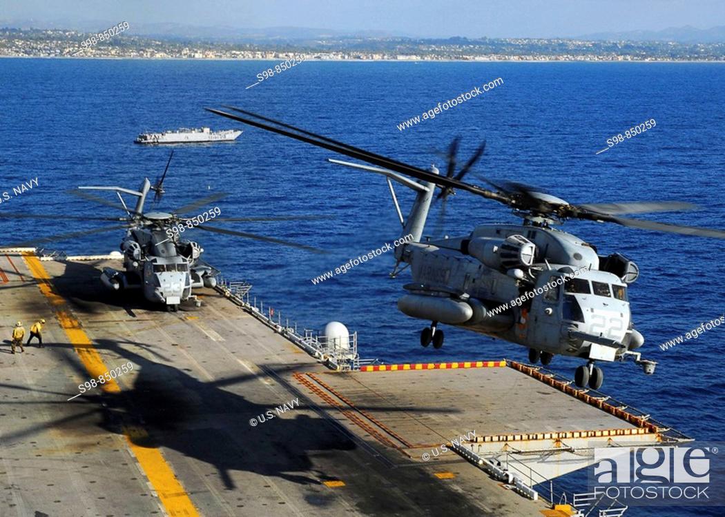 Stock Photo: PACIFIC OCEAN (Nov. 3, 2008) A CH-53E Super Stallion helicopter descends to the flight deck during operations to disembark Marines after a scheduled six-month.