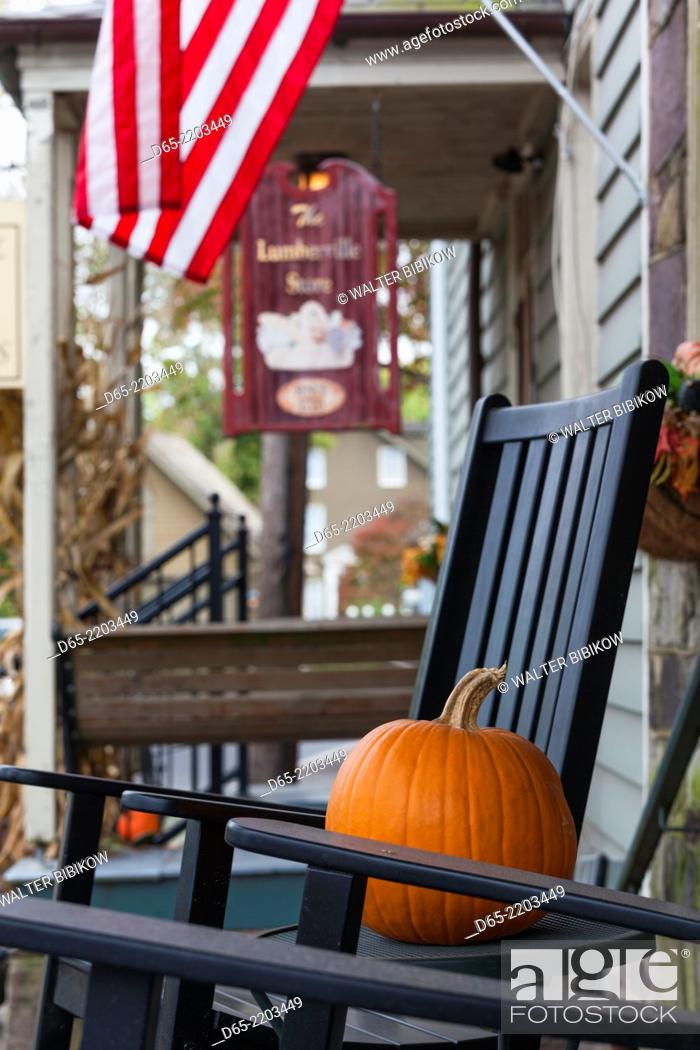 Stock Photo: USA, Pennsylvania, Bucks County, Lumberville, pumpkin and rocking chair.