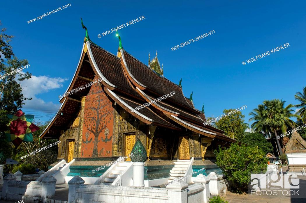 Stock Photo: View of the Tree of Life mosaic on the sims back wall of Wat Xieng Thong in the UNESCO world heritage town of Luang Prabang in Central Laos.