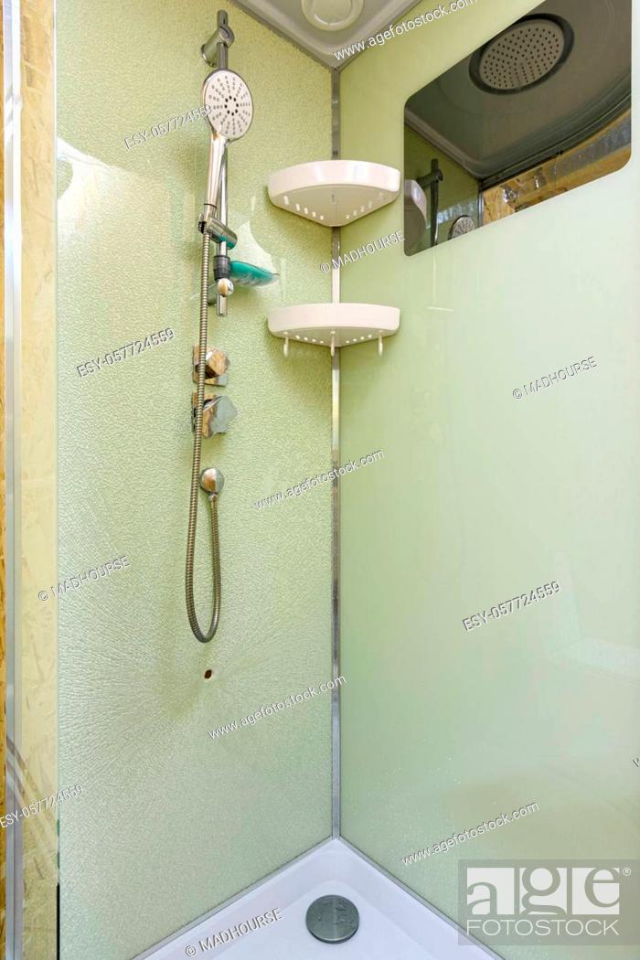 Stock Photo: At the back wall of the shower stall on which the mixer and shower are located the glass cracked.