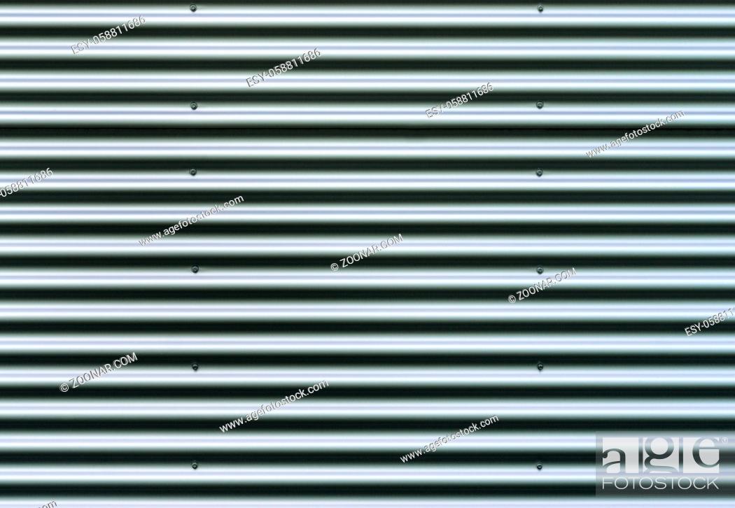 Stock Photo: Closeup stainless steel corrugated sheet. Ridged reinforced metal surface for protection. Metallic background texture.