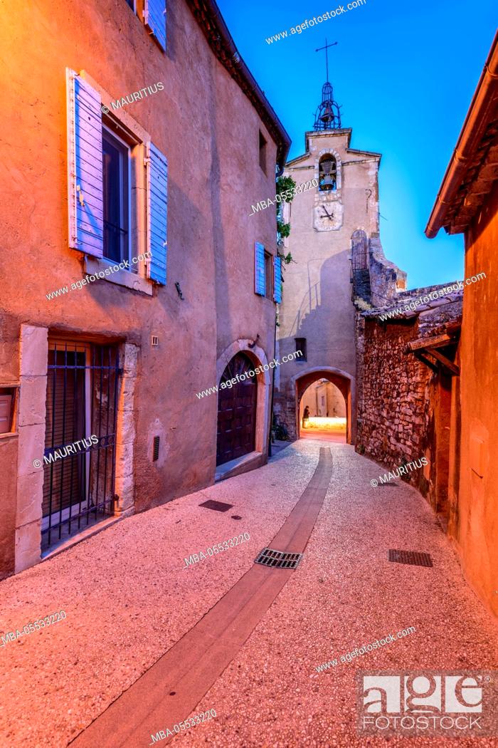 Stock Photo: France, Provence, Vaucluse, Roussillon, old town alley with bell tower.
