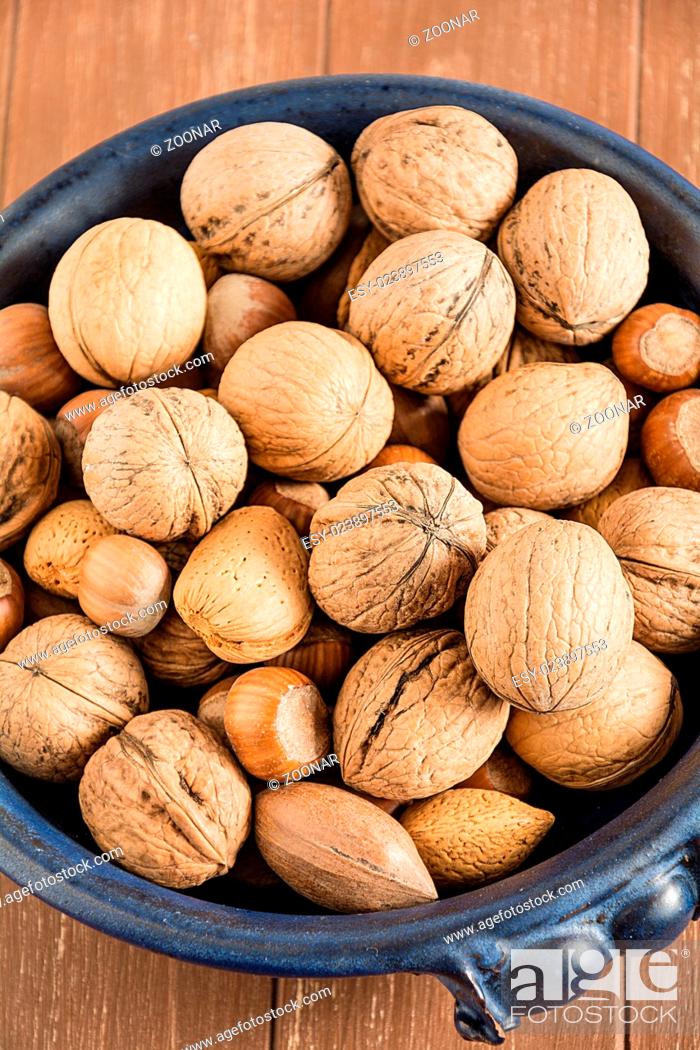Stock Photo: Walnuts, hazelnuts, almonds and pecans.