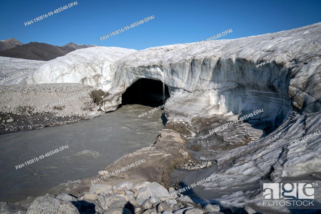 Stock Photo: 15 August 2019, Canada, Pond Inlet: A massive glacier shows up at Pond Inlet, in the Canadian Arctic. The small Inuit settlement with only 1.