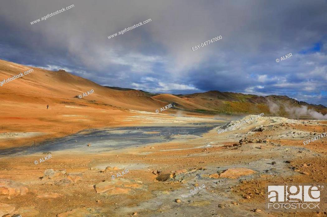 Stock Photo: Fumaroles with volcanic boiling mud pots surrounded by sulfur hot springs in Hverir Namafjall geothermal valley in Iceland.