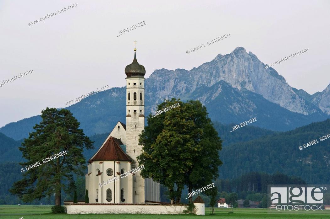 Stock Photo: Church of St Coloman, Tannheim Mountains at the back, near Fuessen, Allgaeu region, Bavaria, Germany, Europe.