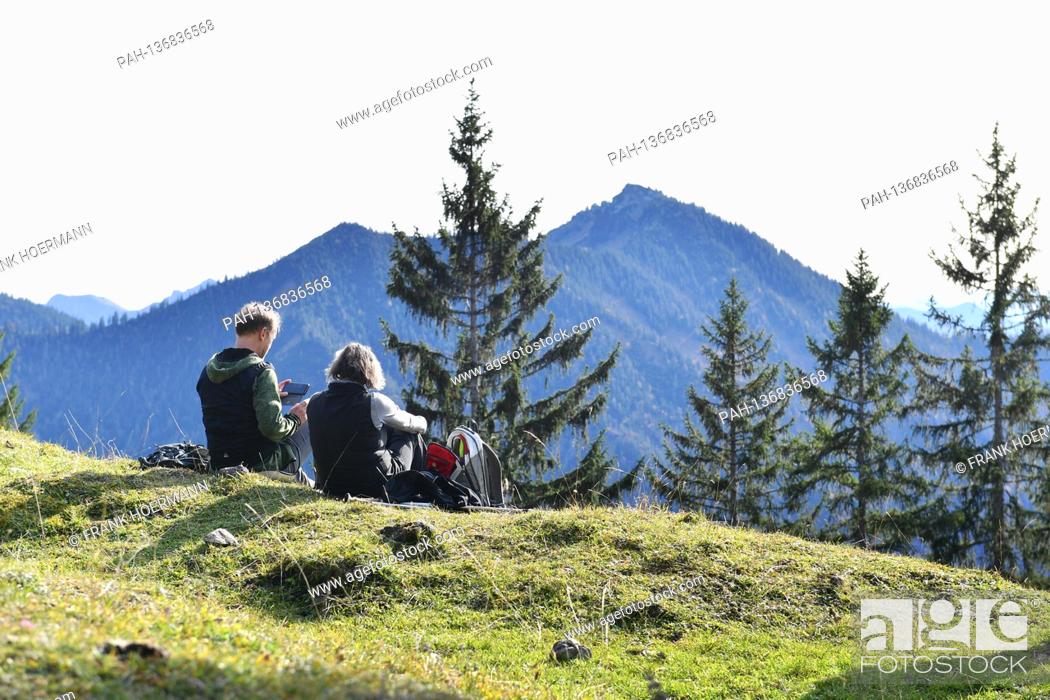 Stock Photo: Golden October hike to Baumgartenschneid over the Tegernsee on October 25th, 2020. Wonderful hiking weather attracts many excursionists to mountain hiking in.