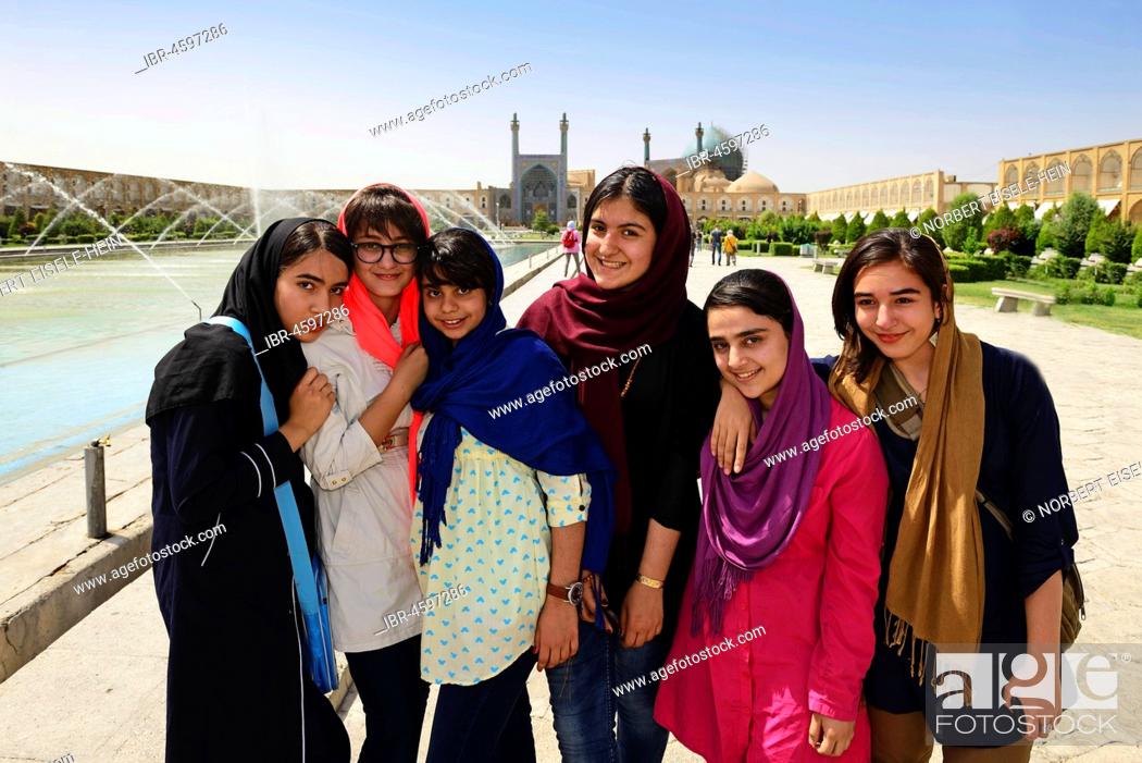 Stock Photo: Girls posing on Imam Square, Meydan-e Naqsh-e Jahan, Isfahan, Iran.
