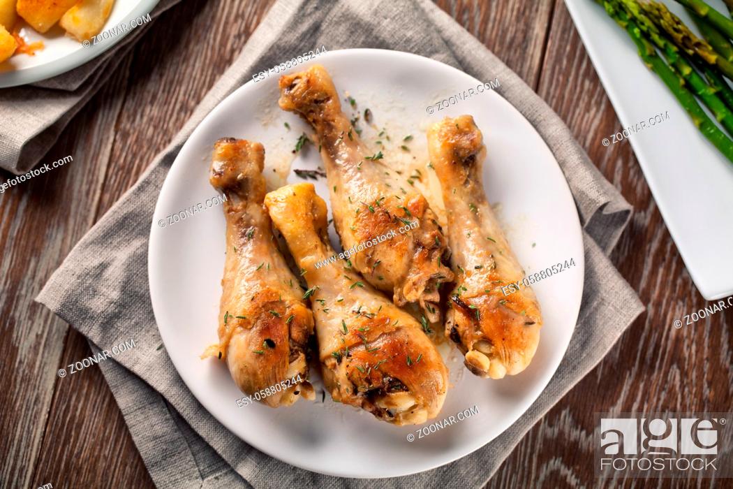 Stock Photo: Roast chicken on a plate. High quality photo.