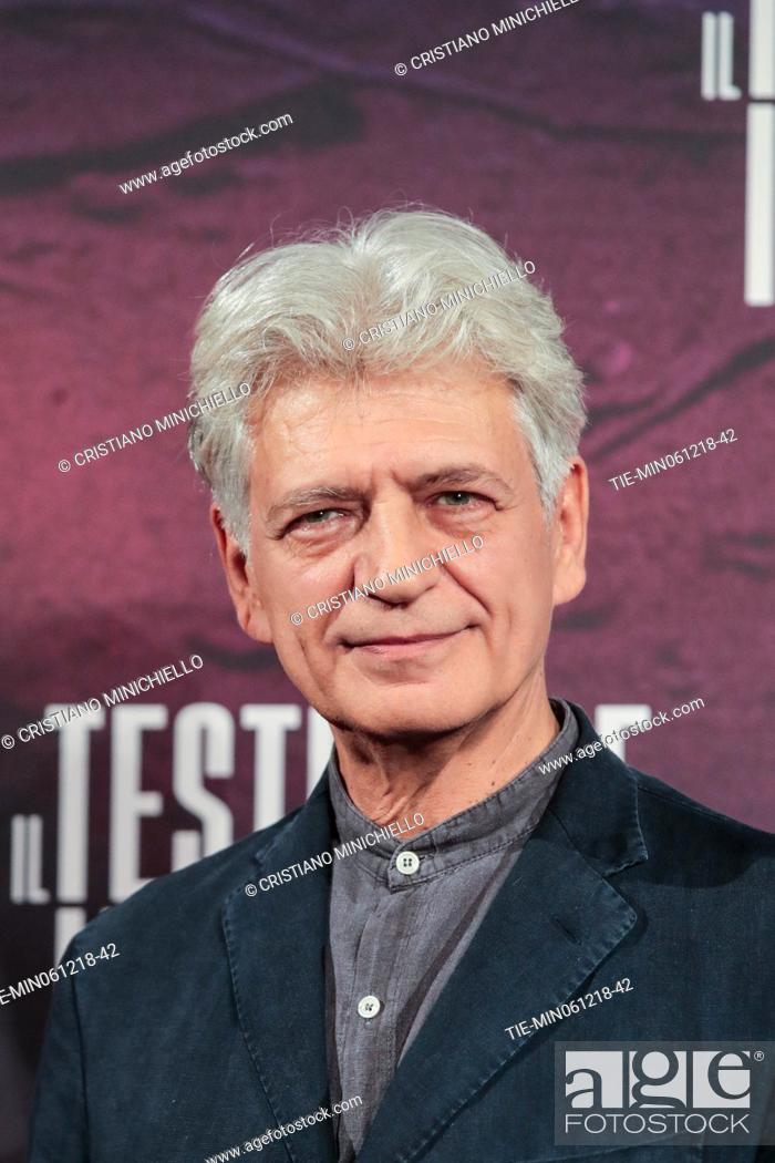 Stock Photo: The actor Fabrizio Bentivoglio during the photocall of film Il testimone invisibile, Rome, ITALY-06-12-2018.