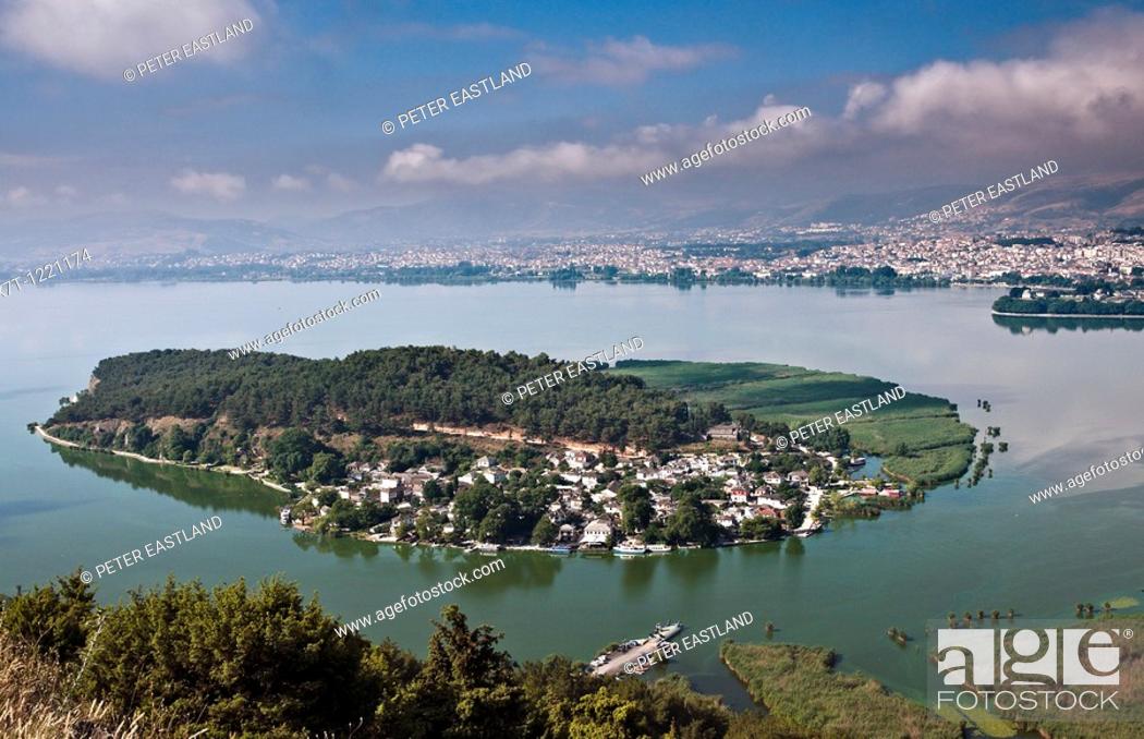 Stock Photo: Looking across the Island of Nissi, on Lake Pamvotidha with the city of Ioannina in the background, Epirus, northern Greece.