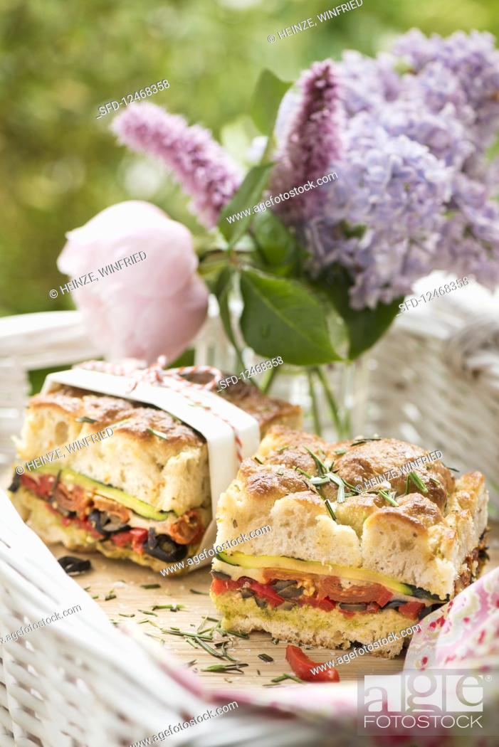 Stock Photo: Stuffed focaccia with courgette, tomatoes and olives for summer picnic.