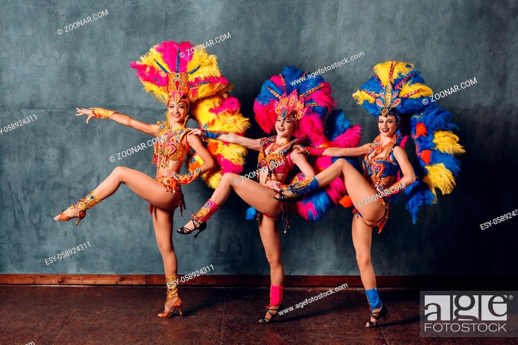 Stock Photo: Three Women in cabaret costume with colorful feathers plumage.